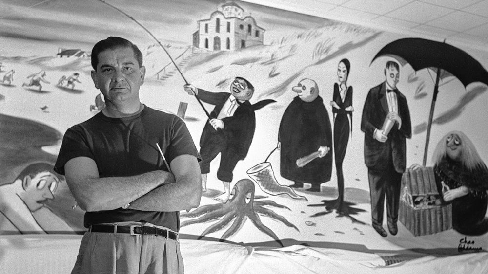 Charles Addams with one of his original cartoons.